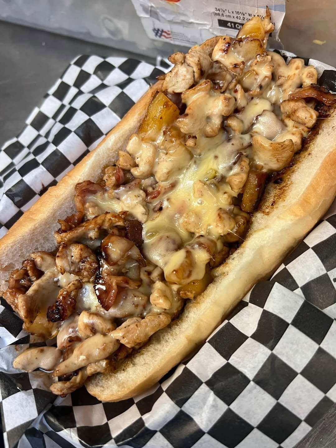 Pineapple teriyaki cheesesteak loaded with chicken, bacon and melted cheese